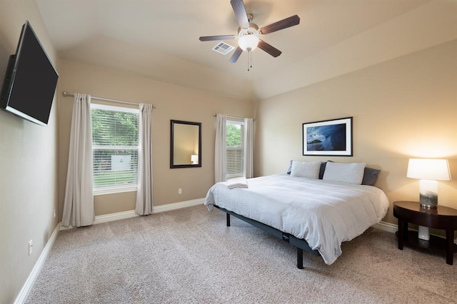 carpeted bedroom with baseboards, a ceiling fan, visible vents, and multiple windows