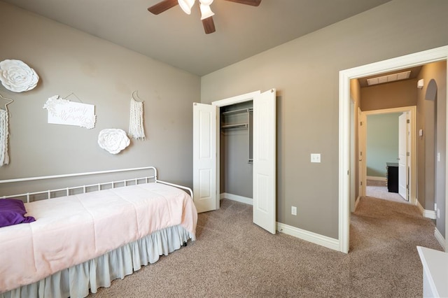 bedroom with light colored carpet, a ceiling fan, baseboards, and visible vents