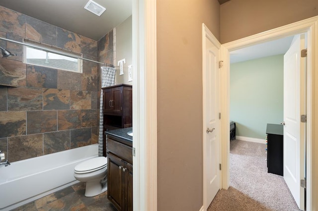 full bathroom featuring vanity, bathtub / shower combination, toilet, and visible vents