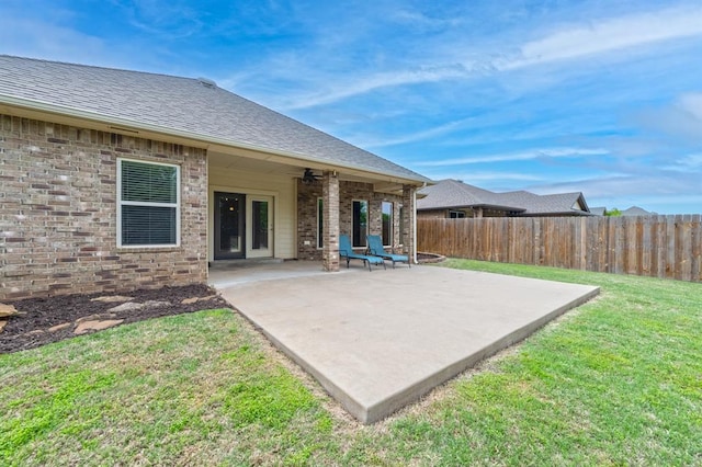 view of patio / terrace featuring ceiling fan and fence