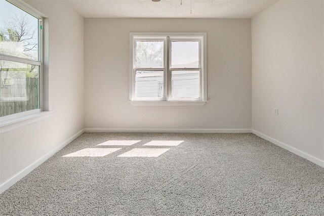 941 SW 48th St, Oklahoma City, OK 73109 - carpeted empty room with plenty of natural light and baseboards