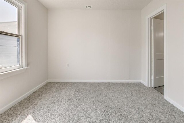 941 SW 48th St, Oklahoma City, OK 73109 - spare room featuring carpet floors and baseboards