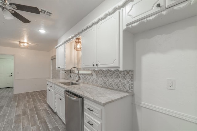 kitchen with ceiling fan, a sink, decorative backsplash, stainless steel dishwasher, and visible vents