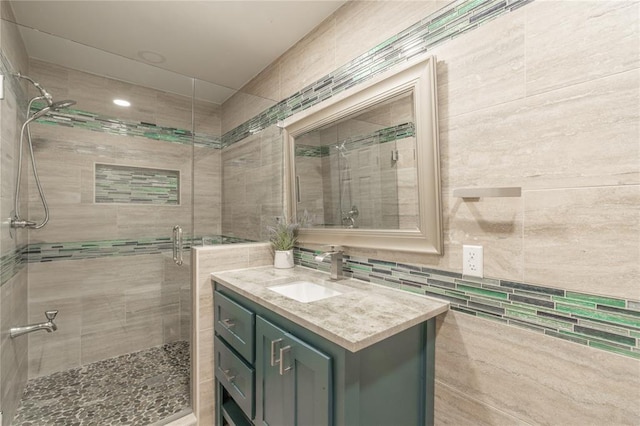 bathroom with vanity and a stall shower