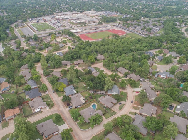 birds eye view of property with a residential view