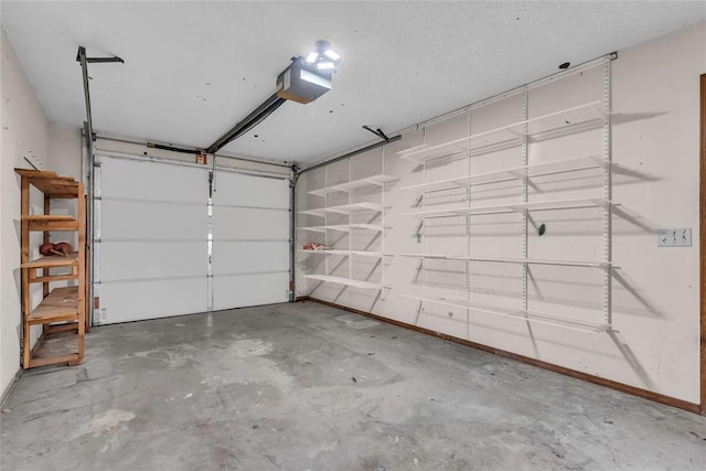 garage featuring baseboards and a garage door opener