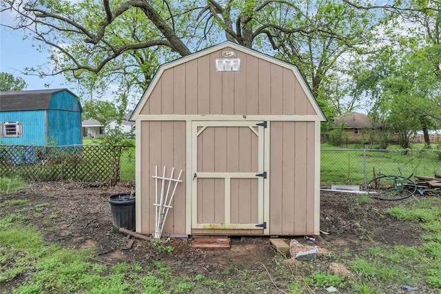 view of shed with fence