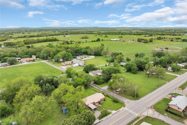 birds eye view of property featuring a rural view