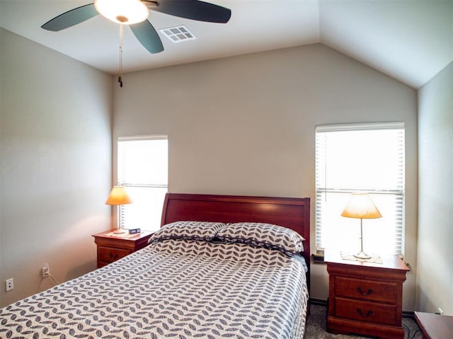 2216 Wheatheart Dr, Yukon, OK 73099 - bedroom with a ceiling fan, visible vents, and lofted ceiling