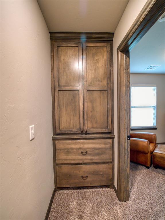 2216 Wheatheart Dr, Yukon, OK 73099 - room details with carpet flooring, baseboards, and visible vents
