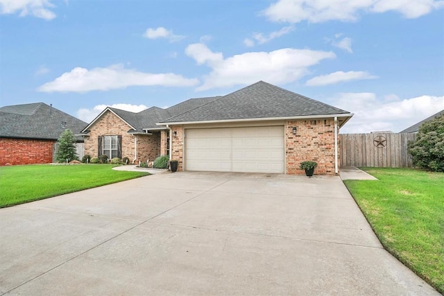 ranch-style home with brick siding, a front yard, fence, and roof with shingles