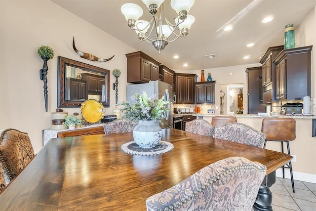 dining space featuring an inviting chandelier, light tile patterned floors, recessed lighting, and visible vents
