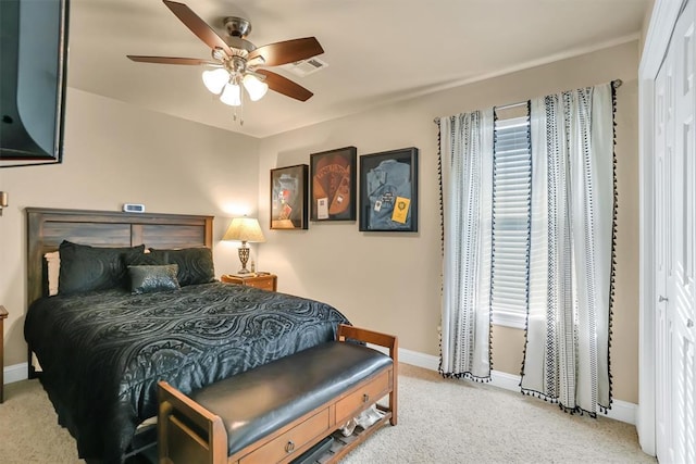bedroom featuring visible vents, a ceiling fan, carpet, and baseboards