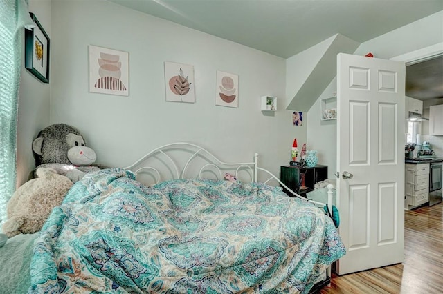 bedroom with wood finished floors