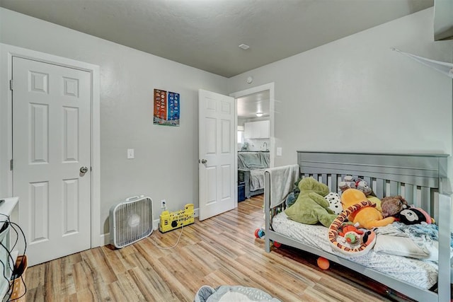 bedroom with wood finished floors