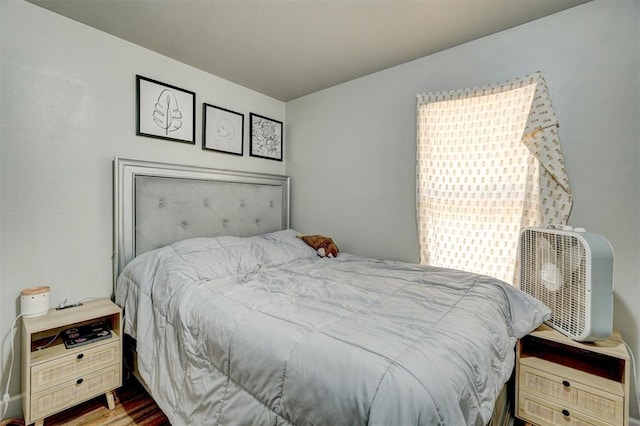 bedroom featuring wood finished floors