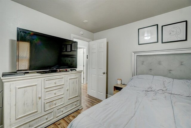 bedroom featuring light wood-type flooring