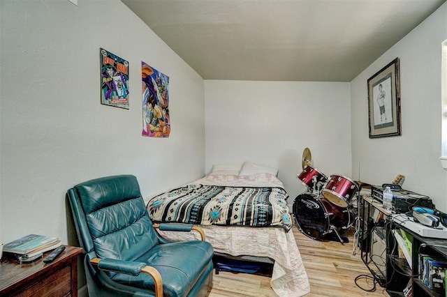 bedroom featuring wood finished floors