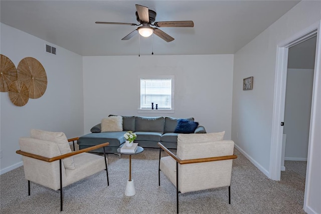 living room with ceiling fan, baseboards, visible vents, and carpet floors