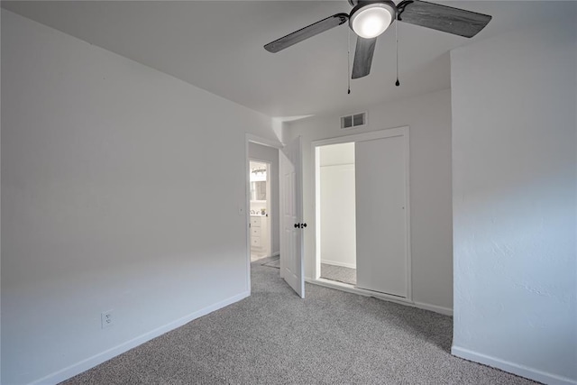 unfurnished bedroom featuring visible vents, ceiling fan, carpet floors, and baseboards