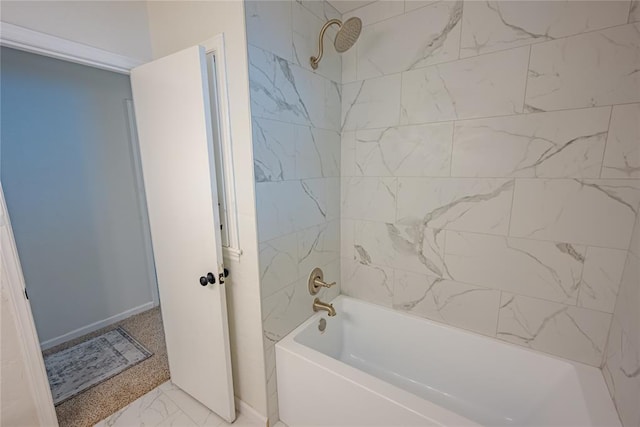 full bathroom with baseboards, washtub / shower combination, and marble finish floor