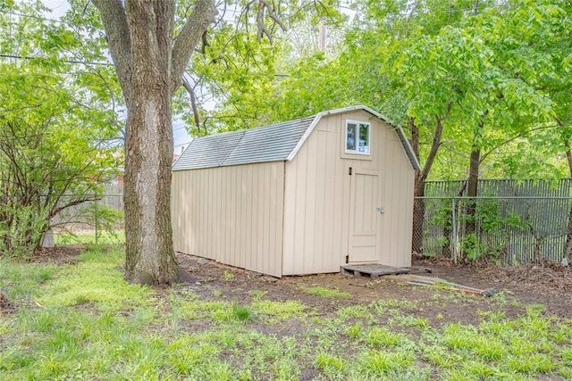 view of shed with a fenced backyard