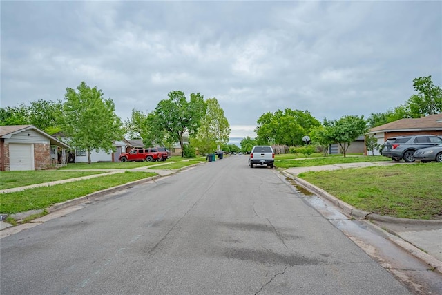 view of road with curbs and sidewalks