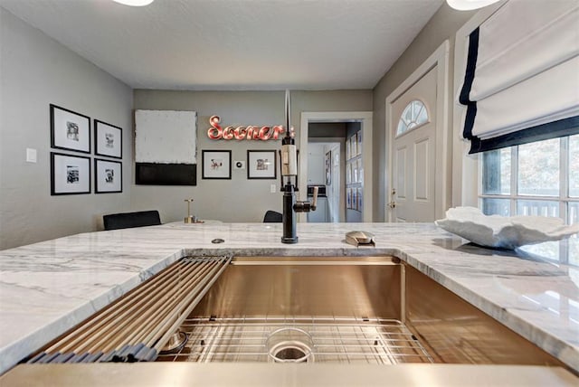 interior space featuring light stone counters