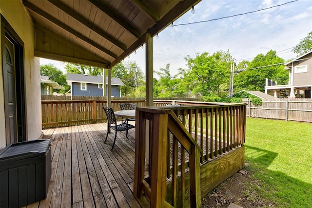 deck with a yard, a fenced backyard, and outdoor dining space