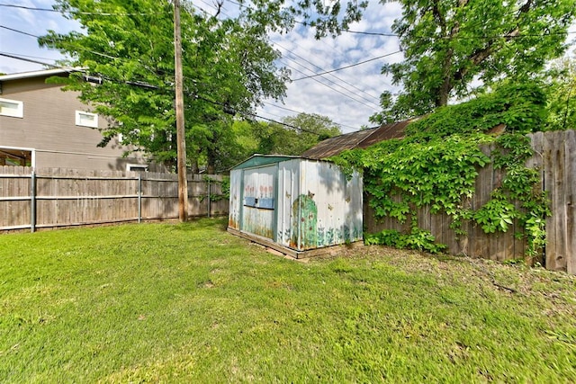 view of shed with a fenced backyard