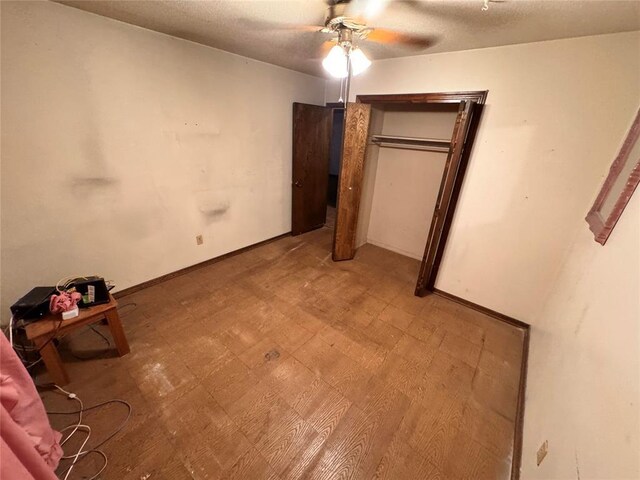 unfurnished bedroom featuring light floors and ceiling fan
