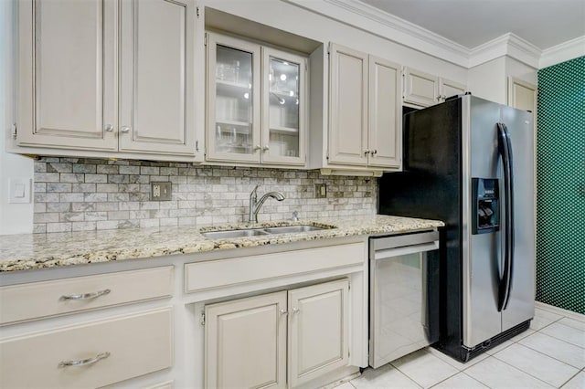 kitchen featuring stainless steel refrigerator with ice dispenser, light stone countertops, a sink, glass insert cabinets, and light tile patterned flooring