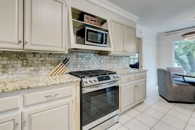 kitchen with decorative backsplash, crown molding, light stone countertops, light tile patterned floors, and stainless steel appliances