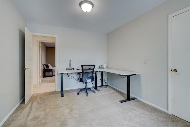 office with baseboards and carpet