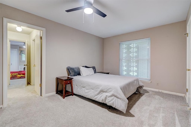 bedroom featuring carpet flooring, baseboards, and ceiling fan