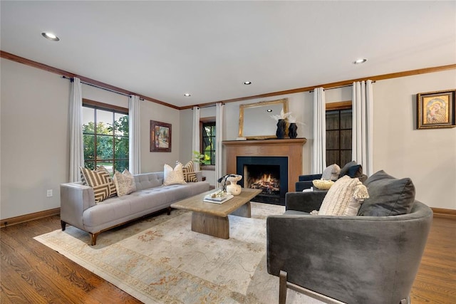 1119 Glenwood Ave, Nichols Hills, OK 73116 - living area featuring recessed lighting, a warm lit fireplace, baseboards, ornamental molding, and wood finished floors