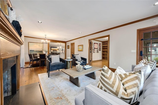 1119 Glenwood Ave, Nichols Hills, OK 73116 - living area featuring crown molding, dark wood-style floors, a chandelier, and baseboards