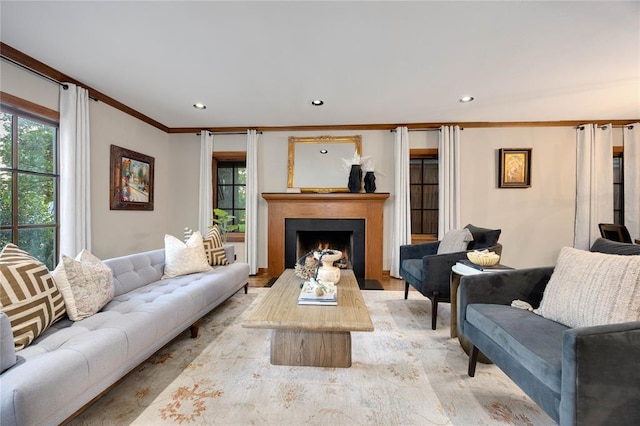 1119 Glenwood Ave, Nichols Hills, OK 73116 - living room featuring recessed lighting, ornamental molding, a wealth of natural light, and a lit fireplace