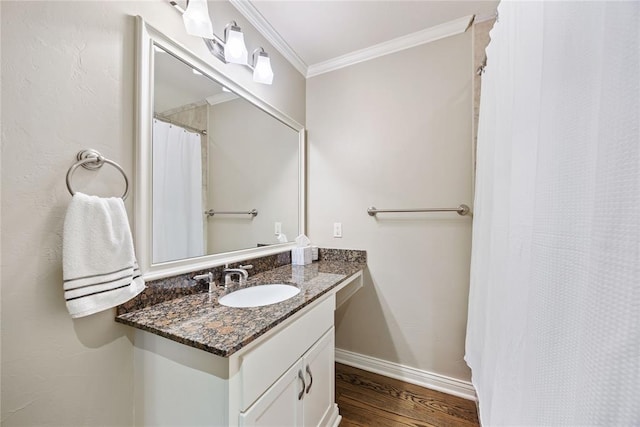 1119 Glenwood Ave, Nichols Hills, OK 73116 - bathroom with crown molding, vanity, wood finished floors, and baseboards