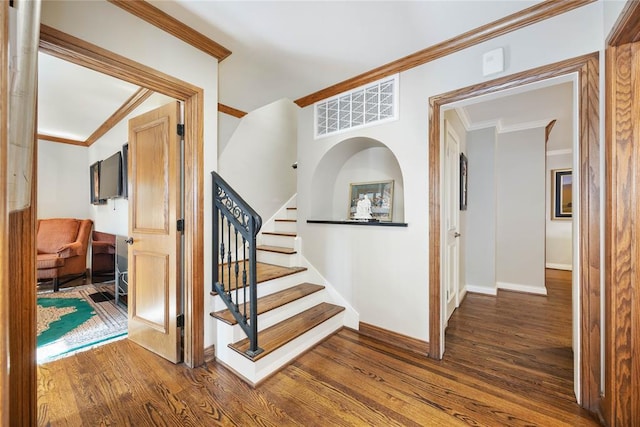 1119 Glenwood Ave, Nichols Hills, OK 73116 - staircase with ornamental molding, visible vents, wood finished floors, and baseboards