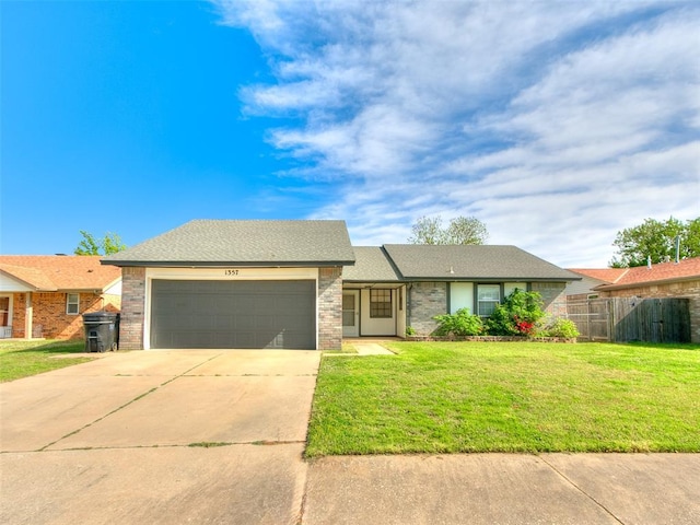 1357 W Cedarbrook Ln, Moore, OK 73170 - ranch-style home with fence, a front yard, driveway, and an attached garage