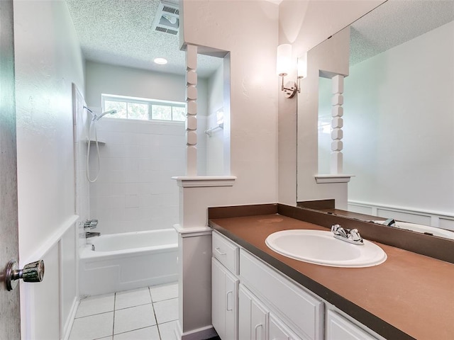 1357 W Cedarbrook Ln, Moore, OK 73170 - bathroom with tile patterned floors, visible vents, a textured ceiling, and vanity