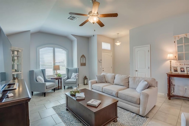 living room with a ceiling fan, visible vents, a wealth of natural light, and lofted ceiling