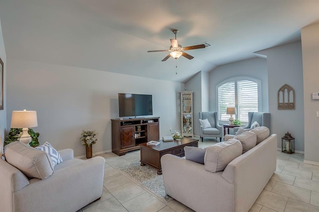 living room with light tile patterned floors, baseboards, ceiling fan, and lofted ceiling
