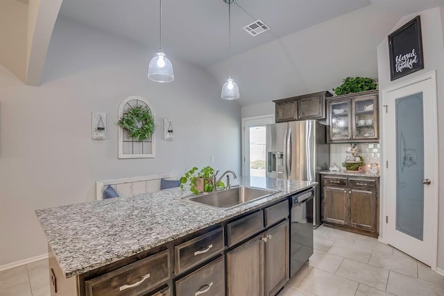 kitchen with a sink, stainless steel fridge with ice dispenser, dishwasher, light tile patterned floors, and visible vents
