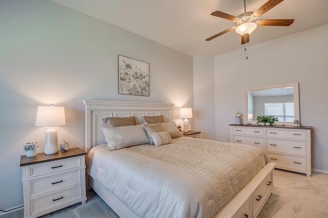 bedroom featuring ceiling fan and light carpet
