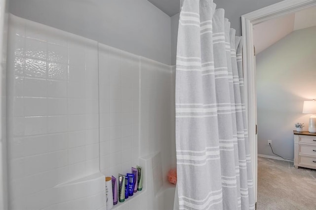 full bathroom with lofted ceiling