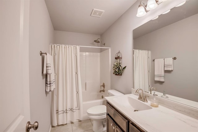 bathroom featuring visible vents, tile patterned flooring, shower / tub combo, vanity, and toilet
