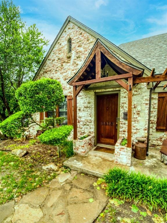 1818 N Union Ave, Shawnee, OK 74804 - property entrance with stone siding and roof with shingles