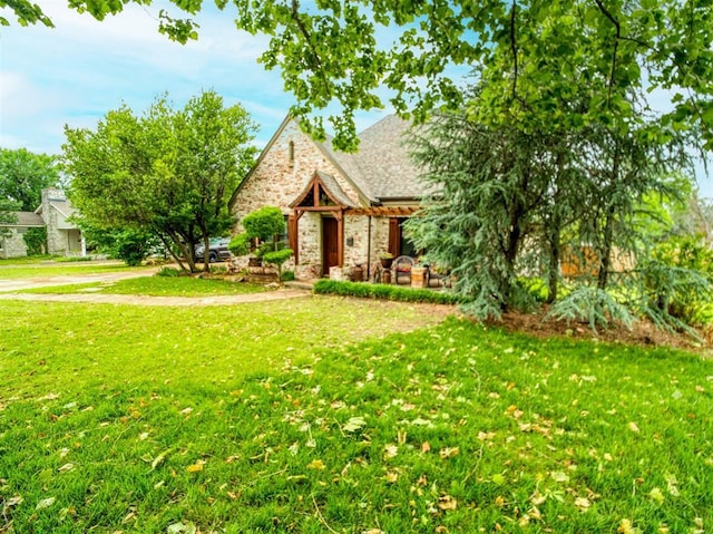 1818 N Union Ave, Shawnee, OK 74804 - view of front of home with a front yard and a shingled roof